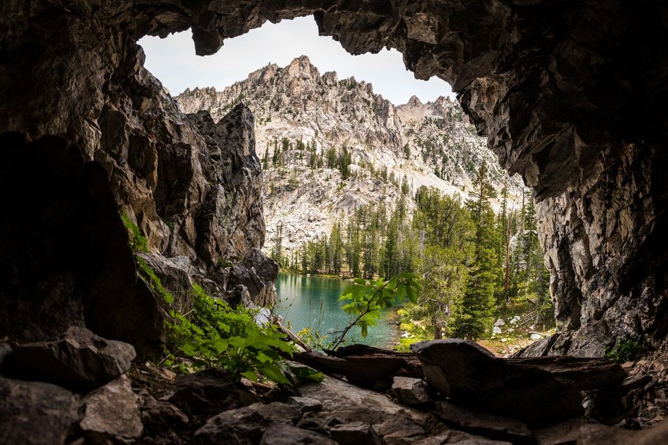 Alpine Cave, Sawtooth Mountains, Idaho. From the mouth of a cave above an alpine lake in the Sawtooth Wilderness, the craggy ridge mimics the cave's opening.