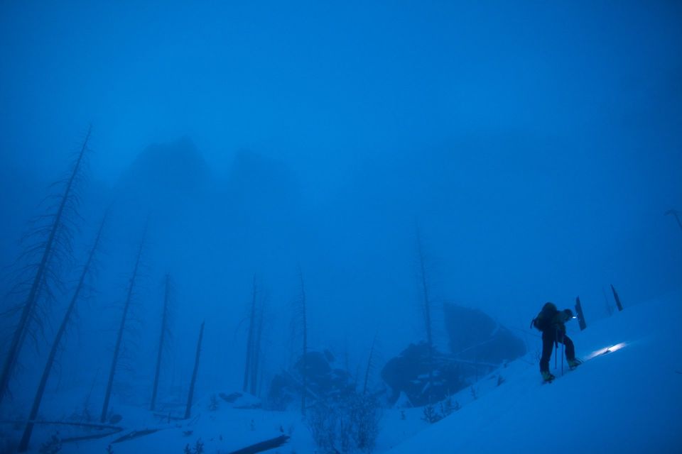 Below the Throne of Ullr. A skier climbs beneath granite spires that look like the armrests of Ullr's throne.