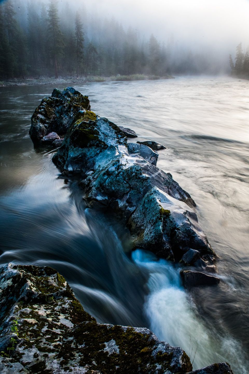 Misty Morning, Salmon River, Idaho. Early morning mist adds layers to the mountains rising above the Salmon River.