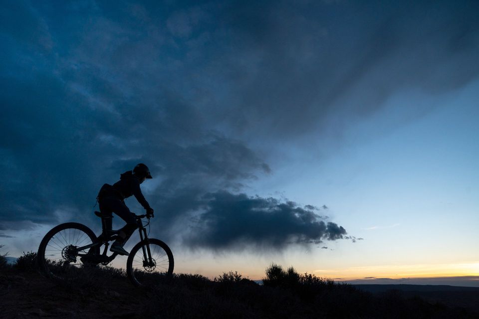 Silhouette. A rider silhouetted against the last light of evening.