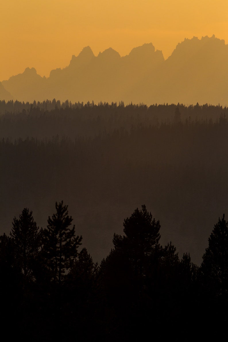 Smoky Sawtooth Mountains, Idaho. Wildfire smoke gives the Sawtooths an orange glow.