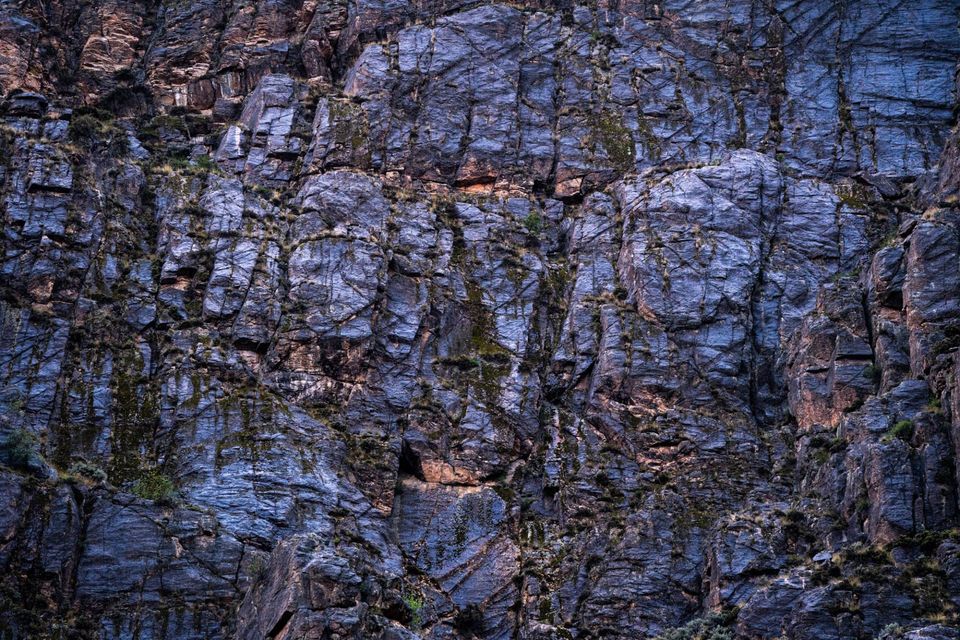 Spring Storm, Stone Slabs. A late-afternoon spring storm wets a stone slab enough to reflect the blue sky once the clouds pass.