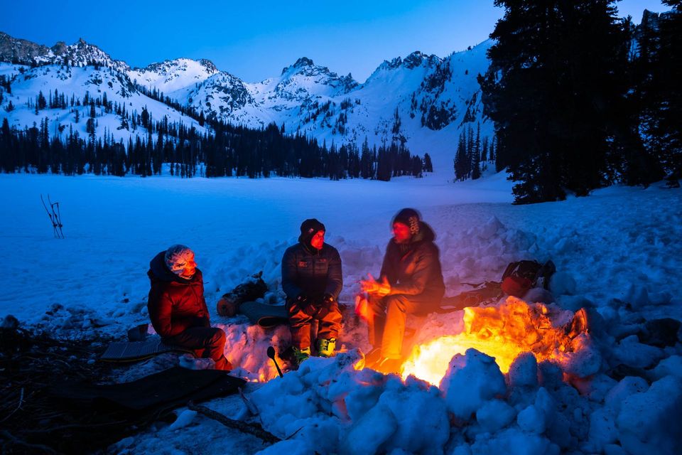 Winter Wilderness Camp. "Here's to good friends, tonight is kinda special." Cheers to warm fires that stretch the days on winter overnights.